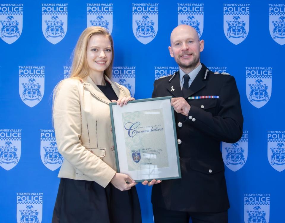 Marie Therese Gumpert receives an award from Jason Hogg, Chief Constable of Thames Valley Police