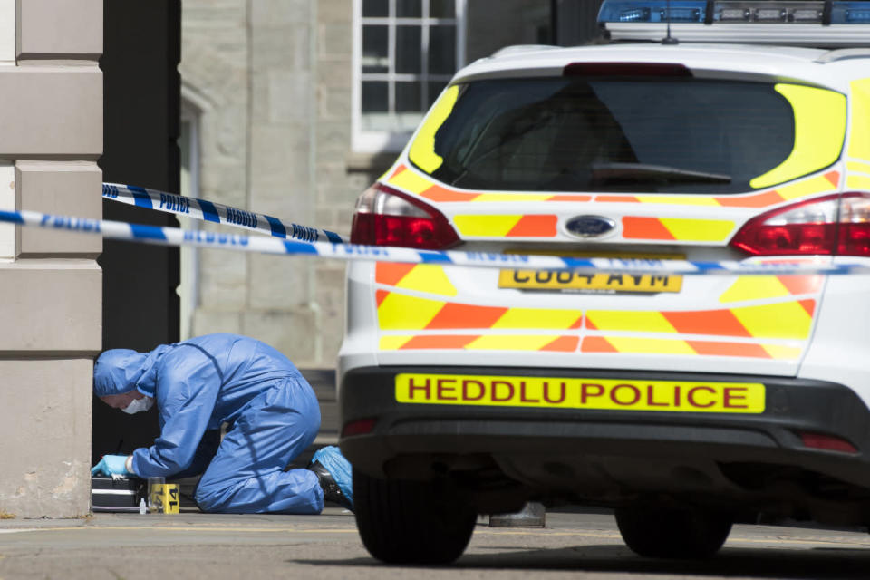 The police forensic team investigate the scene after a soldier died on his way to hospital having been found found injured and unconscious in the town centre on May 8, 2016 in Brecon, United Kingdom. The soldier was found unconcious in the early hours of this morning on Lion Street in the Welsh town of Brecon. The death is being treated as “unexplained”, with reportedly no initial indications that the incident has links to terrorism. (Matthew Horwood/Getty Images)