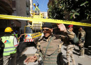 Army soldiers guard the site of a discovery where archaeologist unearthed a coffin containing three mummies in Alexandria, Egypt July 19, 2018. REUTERS/Mohamed Abd El Ghany