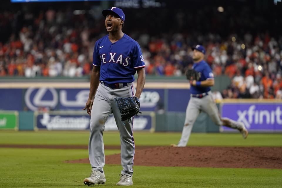 Texas Rangers relief pitcher Jose Leclerc reacts after striking out Texas Rangers' Jonah Heim to end the eighth inning of Game 6 of the baseball AL Championship Series Sunday, Oct. 22, 2023, in Houston. (AP Photo/Godofredo A. Vásquez)