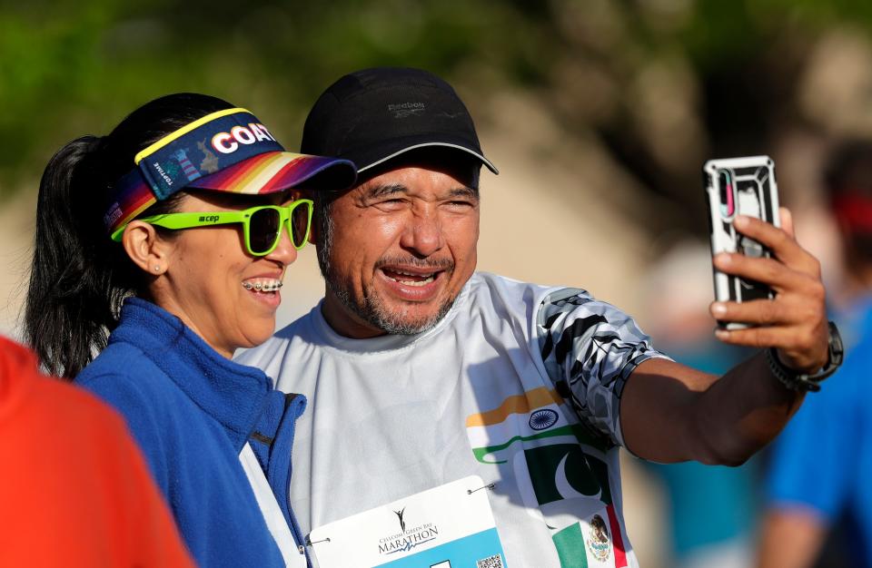 Race participants take a selfie before the start of the Cellcom Green Bay Marathon on Sunday.