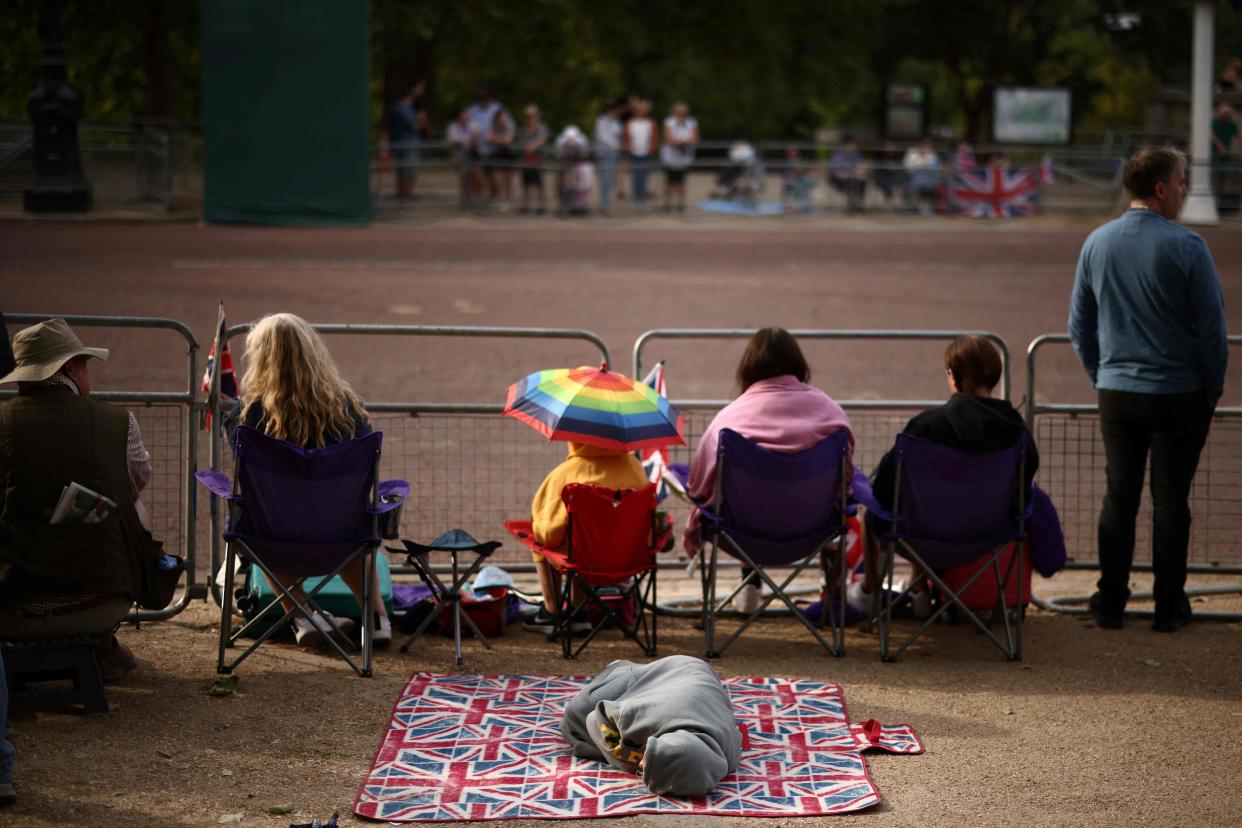 Well-wishers gather along The Mall prior to the King's Birthday Parade, 'Trooping the Colour' (AFP via Getty Images)