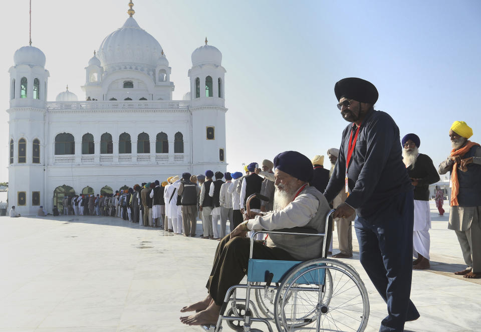 Sikh pilgrims visit the shrine of their spiritual leader Guru Nanak Dev, at Gurdwara Darbar Sahib in Kartarpur, Pakistan. Pakistan's prime minister Imran Khan has inaugurated a visa-free initiative that allows Sikh pilgrims from India to visit one of their holiest shrines. Khan opened the border corridor on Saturday as thousands of Indian pilgrims waited to visit the Kartarpur shrine. (AP Photo/K.M. Chaudary)