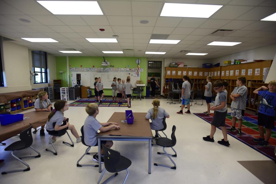 Kids gather inside a classroom during the Port Huron Police Department's annual Law Enforcement Elementary Camp on Wednesday, June 22, 2022, at Garfield Elementary School.