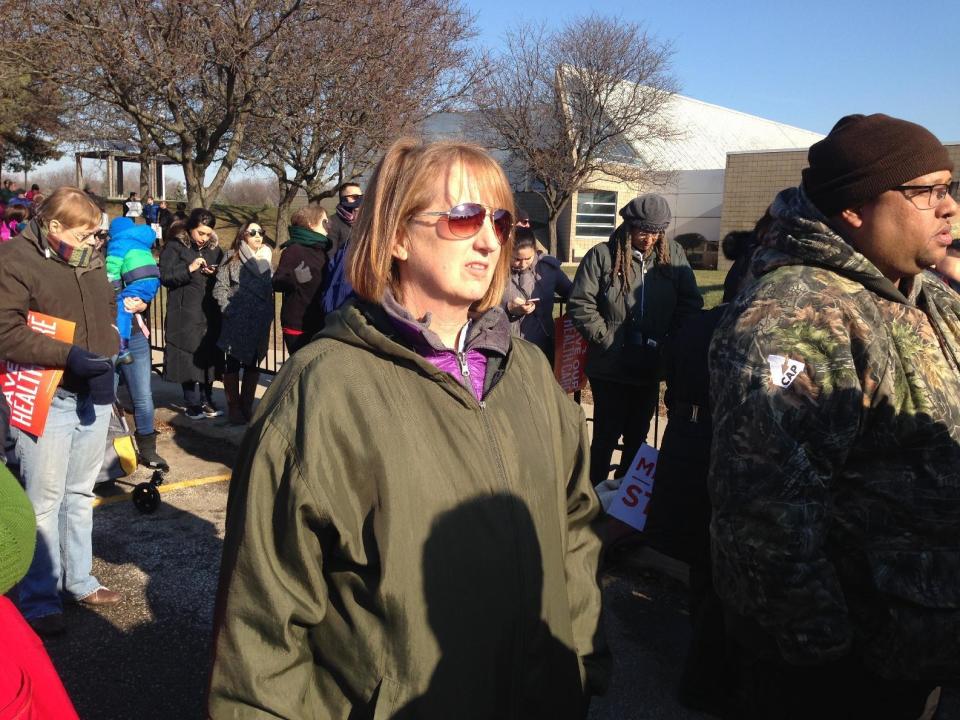 Lisa Bible is one of thousands supporters of the Affordable Care Act who turned out Sunday, Jan. 15, 2016, in Warren, Mich., to hear Democratic U.S. Sen. Bernie Sanders speak against Republican efforts to repeal the law. Bible has her health insurance through the law and worries that she may not be able to afford medical treatment if it's repealed. (AP Photo/Corey Williams)