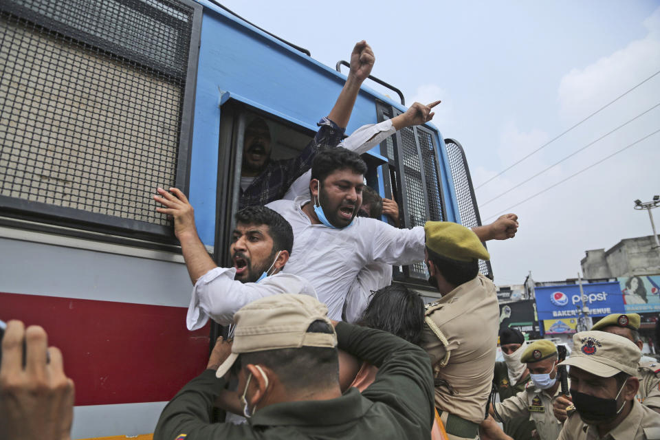 Members of National Students' Union of India (NSUI), are being detained and taken away by police during protest marking the second anniversary of Indian government scrapping Kashmir’s semi- autonomy in Jammu, India, Thursday, Aug. 5, 2021. On Aug. 5, 2019, Indian government passed legislation in Parliament that stripped Jammu and Kashmir’s statehood, scrapped its separate constitution and removed inherited protections on land and jobs. (AP Photo/Channi Anand)