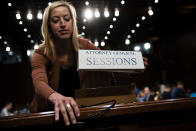 <p>A Senate staff member places a name card for US Attorney General Jeff Sessions before a hearing of the Senate Select Intelligence Committee on Capitol Hill June 13, 2017 in Washington, D.C. (Photo: Brendan Smialowski/AFP/Getty Images) </p>