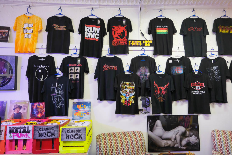 Various music artist t-shirts hang on the walls for purchase Tuesday at High Fidelity record store on Sixth Avenue in Amarillo.