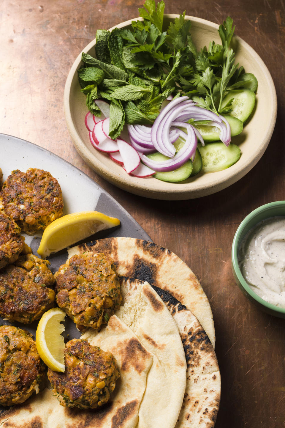 This image released by Milk Street shows a recipe for chickpea and feta meatballs. (Milk Street via AP)