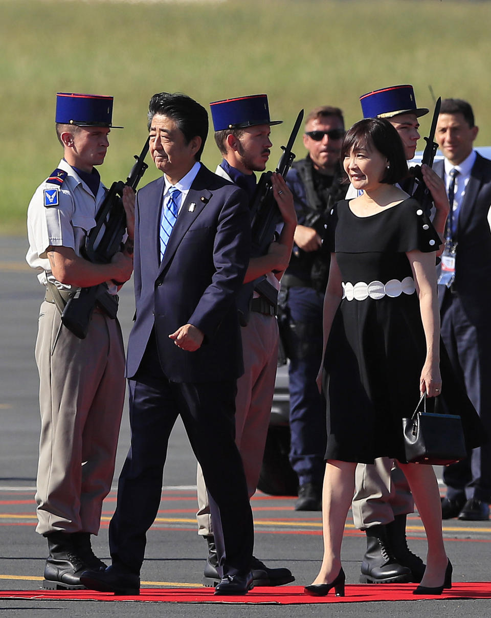 Japanese Prime Minister Shinzo Abe and his wife Akie Abe arrive at the airport in Biarritz, France, for the first day of the G-7 summit, Saturday, Aug. 24, 2019. U.S. President Donald Trump and the six other leaders of the Group of Seven nations will begin meeting Saturday for three days in the southwestern French resort town of Biarritz. France holds the 2019 presidency of the G-7, which also includes Britain, Canada, Germany, Italy and Japan. (AP Photo/Peter Dejong)