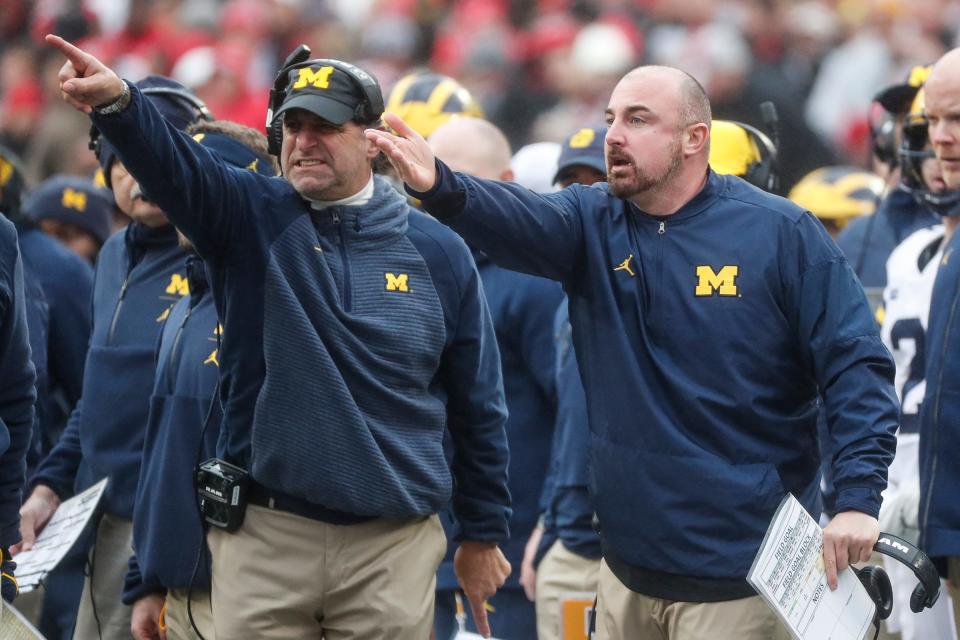Michigan cornerback coach Michael Zordich, left, and safeties coach and special team coordinator Chris Partridge react to a call by the referee during the first half against Ohio State at Ohio Stadium in Columbus, Ohio, Saturday, Nov. 24, 2018.