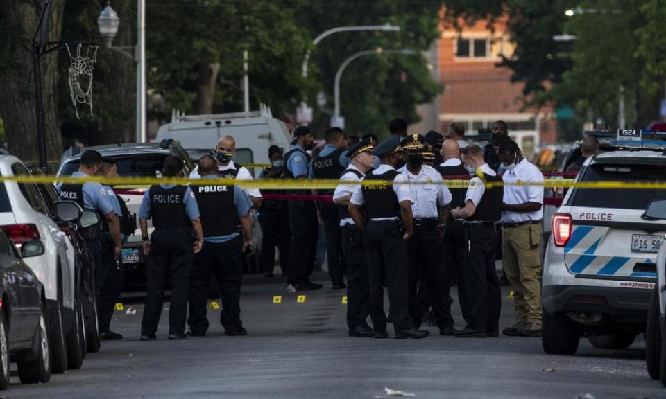 Chicago police investigate the scene where a seven-year-old girl was fatally shot in the Austin neighborhood of Chicago on Friday.