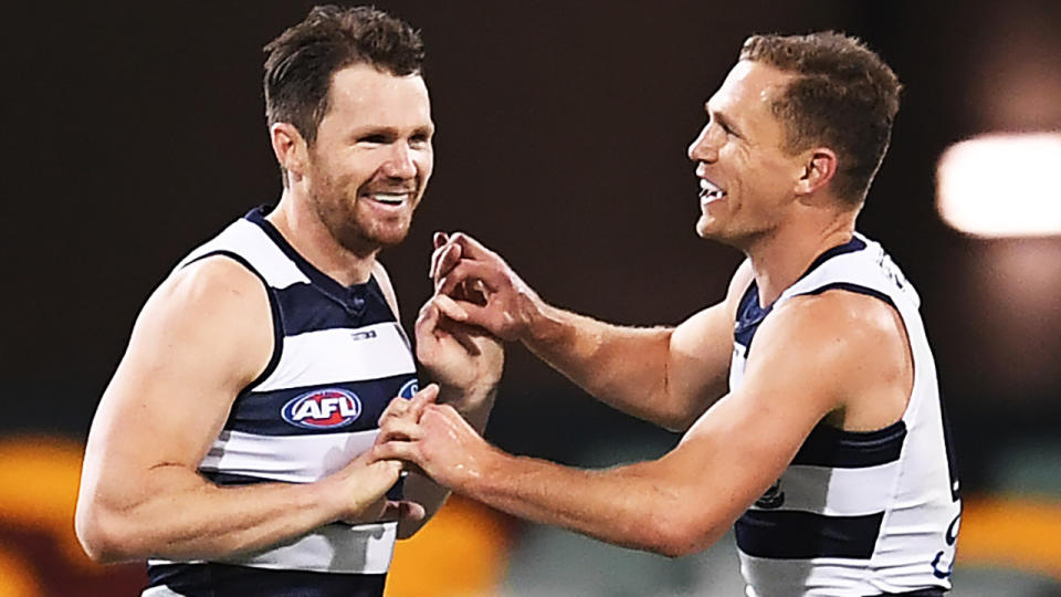 Patrick Dangerfield and Joel Selwood are pictured celebrating a goal.