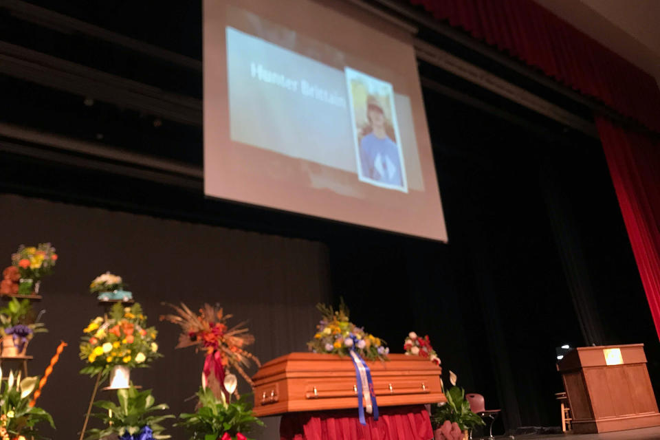 The casket of Hunter Brittain sits on the stage of the Beebe High School Auditorium before a memorial service in Beebe, Ark., Tuesday, July 6, 2021. Brittain, 17, was shot and killed by a Lonoke County Sheriff's deputy during a traffic stop on June 23. (AP Photo/Andrew Demillo)