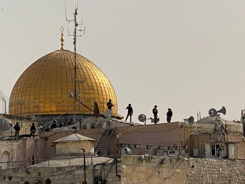 FILE PHOTO: Israeli security forces on rooftops in front of the Dome of the Rock in Jerusalem's Old City