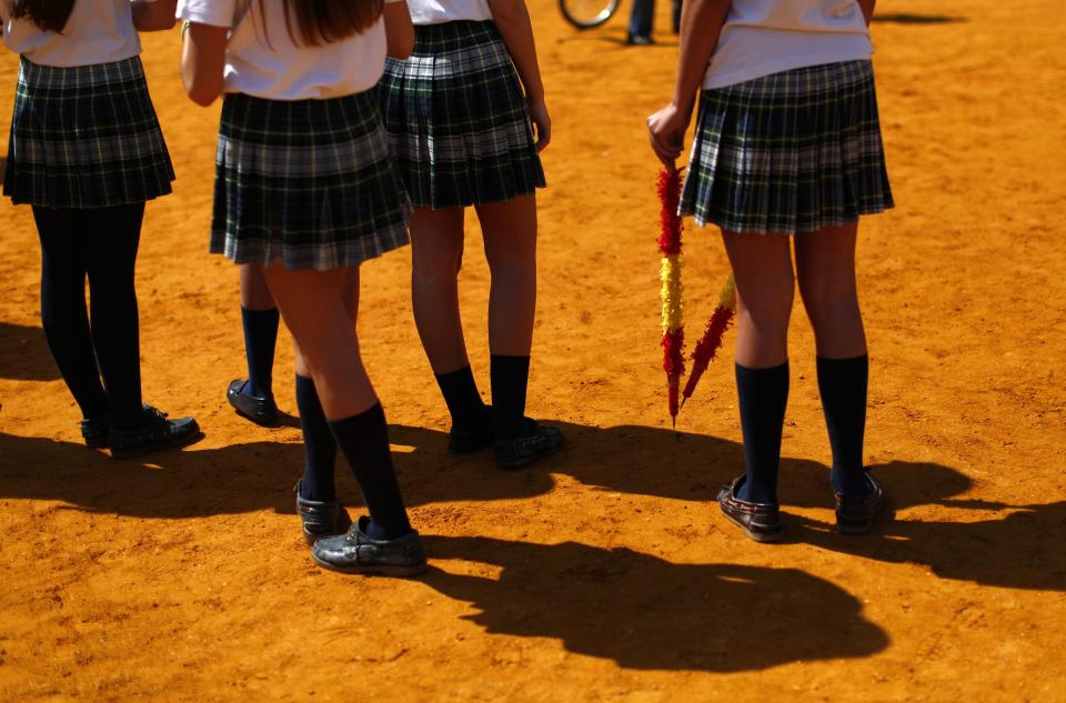 A student holds a pair of banderillas during a bullfight master class for schoolchildren at the Maestranza bullring in the Andalusian capital of Seville