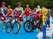 Canada's Kyle Jones runs with his bike in the transition zone as he races in the men's triathlon at Hyde Park during the Summer Olympics in London on Tuesday, August 7, 2012. THE CANADIAN PRESS/Sean Kilpatrick