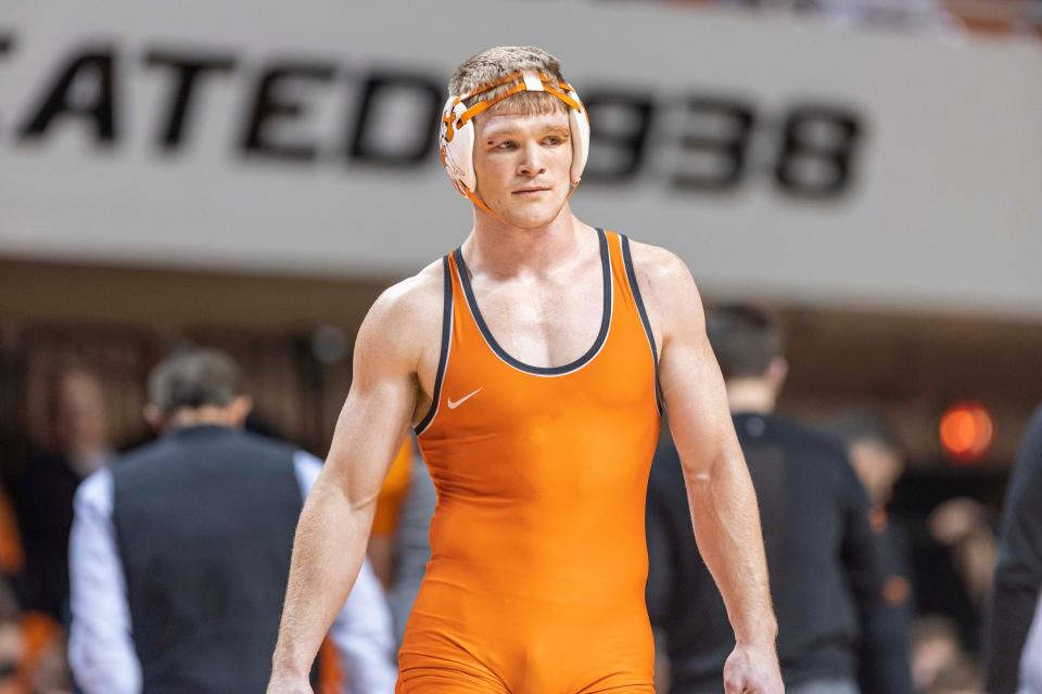 Oklahoma State 174-pounder Dustin Plott earned a 14-11 win against West Virginia's Scott Joll on Sunday inside Gallagher-Iba Arena in Stillwater.