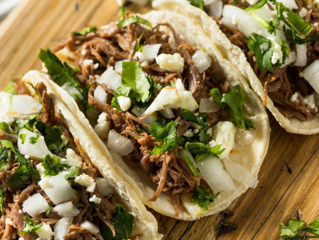Spicy Homemade Beef Barbacoa Tacos with Cilantro Cheese and Onion