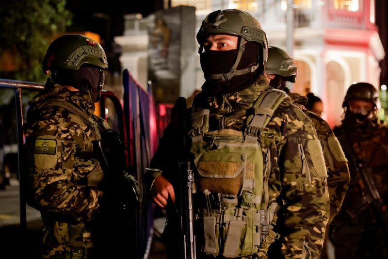 Police and military officials outside the Flagrancy Unit, where former Ecuador Vice President Jorge Glas is believed to be detained, in Quito