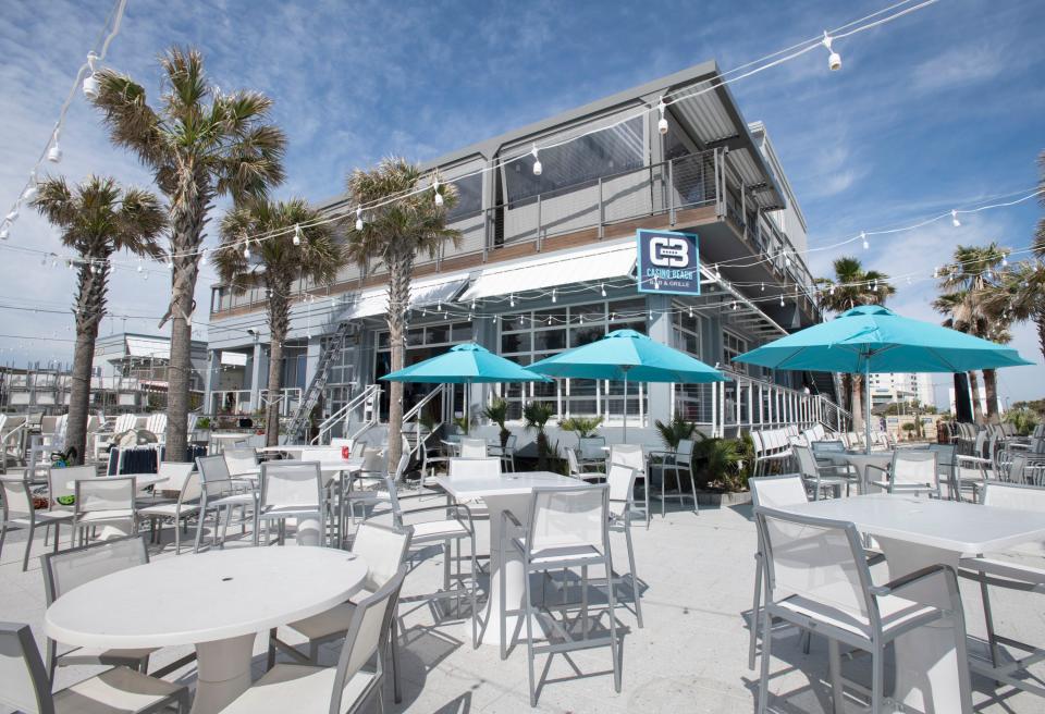 New tables, chairs, and umbrellas are being readied while being temporarily closed for repairs after Hurricane Sally at the Casino Beach Bar & Grille in Pensacola Beach on Friday, March 5, 2021.  The restaurant will be reopening soon.