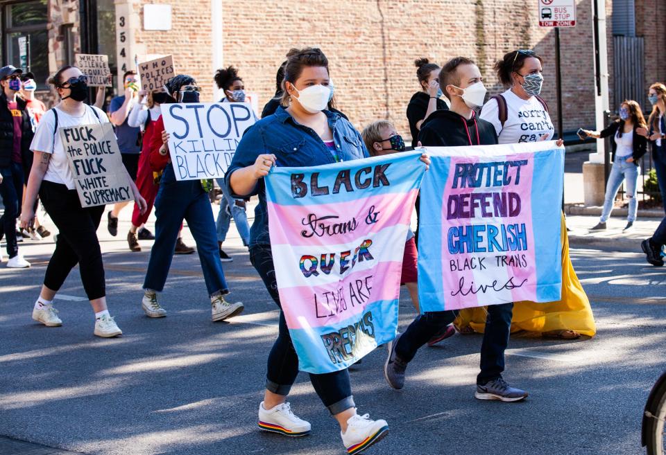 CHICAGO, ILLINOIS - JUNE 14:  Crowds carry signs during a march in support of Black Lives Matter and Black Trans Lives in Boystown on June 14, 2020 in Chicago, Illinois. Protests erupted across the nation after George Floyd died in police custody in Minneapolis, Minnesota on May 25th. (Photo by Natasha Moustache/Getty Images) ORG XMIT: 775523272 ORIG FILE ID: 1249757323