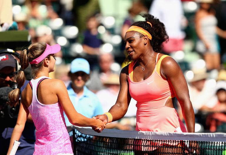 Serena Williams shakes hands at the net after her straight set victory against Catherine Bellis in their third round match during the Miami Open on March 29, 2015 in Key Biscayne, Florida