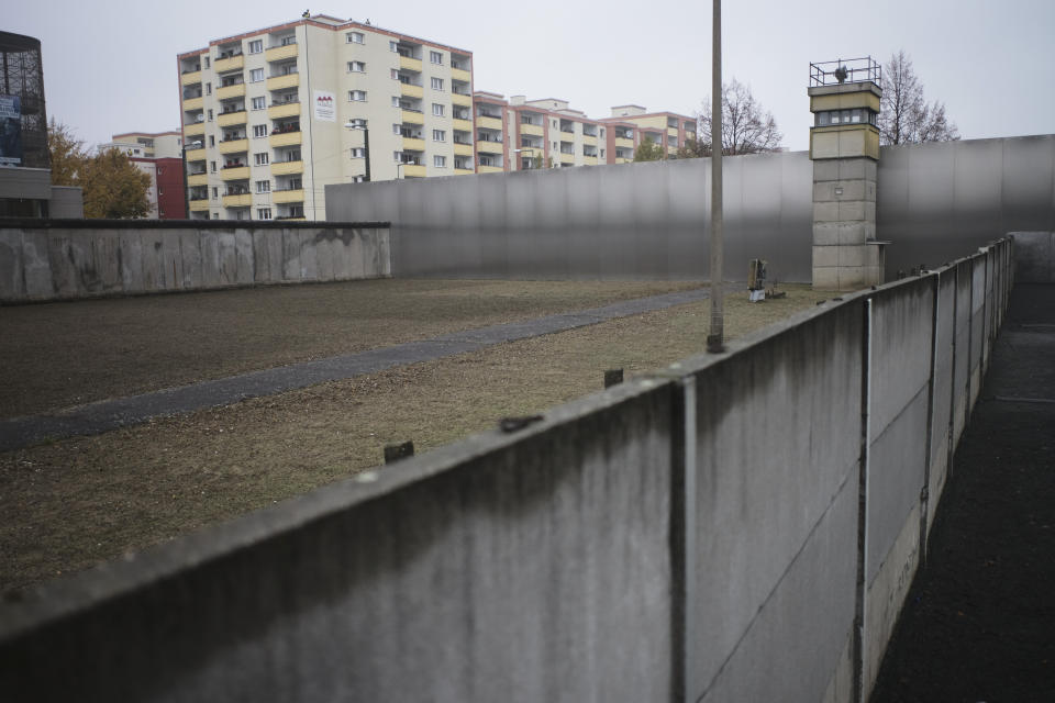 Grey clouds cover the sky over the Berlin Wall memorial site at Bernauer Strasse prior to a commemoration ceremony to celebrate the 30th anniversary of the fall of the Wall in Berlin, Germany, Saturday, Nov. 9, 2019. (AP Photo/Markus Schreiber)