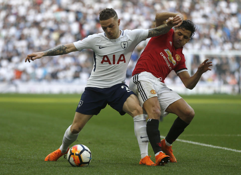 FILE - In this Saturday, April 21, 2018 file photo, Tottenham Hotspur's Kieran Tripper, left fends off the challenge of Manchester United's Alexis Sanchez during the English FA Cup semifinal soccer match between Manchester United and Tottenham Hotspur at Wembley stadium in London. It has often been viewed as the least glamorous position in soccer, a role no kid wanted to have on the school field and one that was long overlooked even in the professional game but the role of the full back, however, has had a makeover in recent years and nowhere is the position’s resurgence better demonstrated than in the Premier League this season. (AP Photo/Frank Augstein, File)