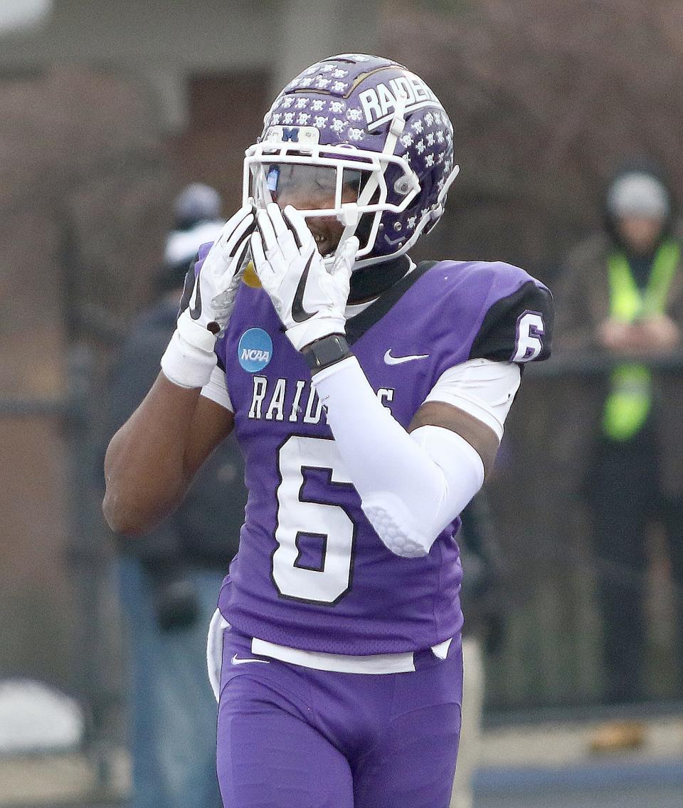 Mount Union's Wayne Ruby Jr., blows kisses to the Mount Union student section in the end zone after scoring a third-quarter touchdown during their Division III football semifinal at Kehres Stadium Saturday, December 10, 2022.