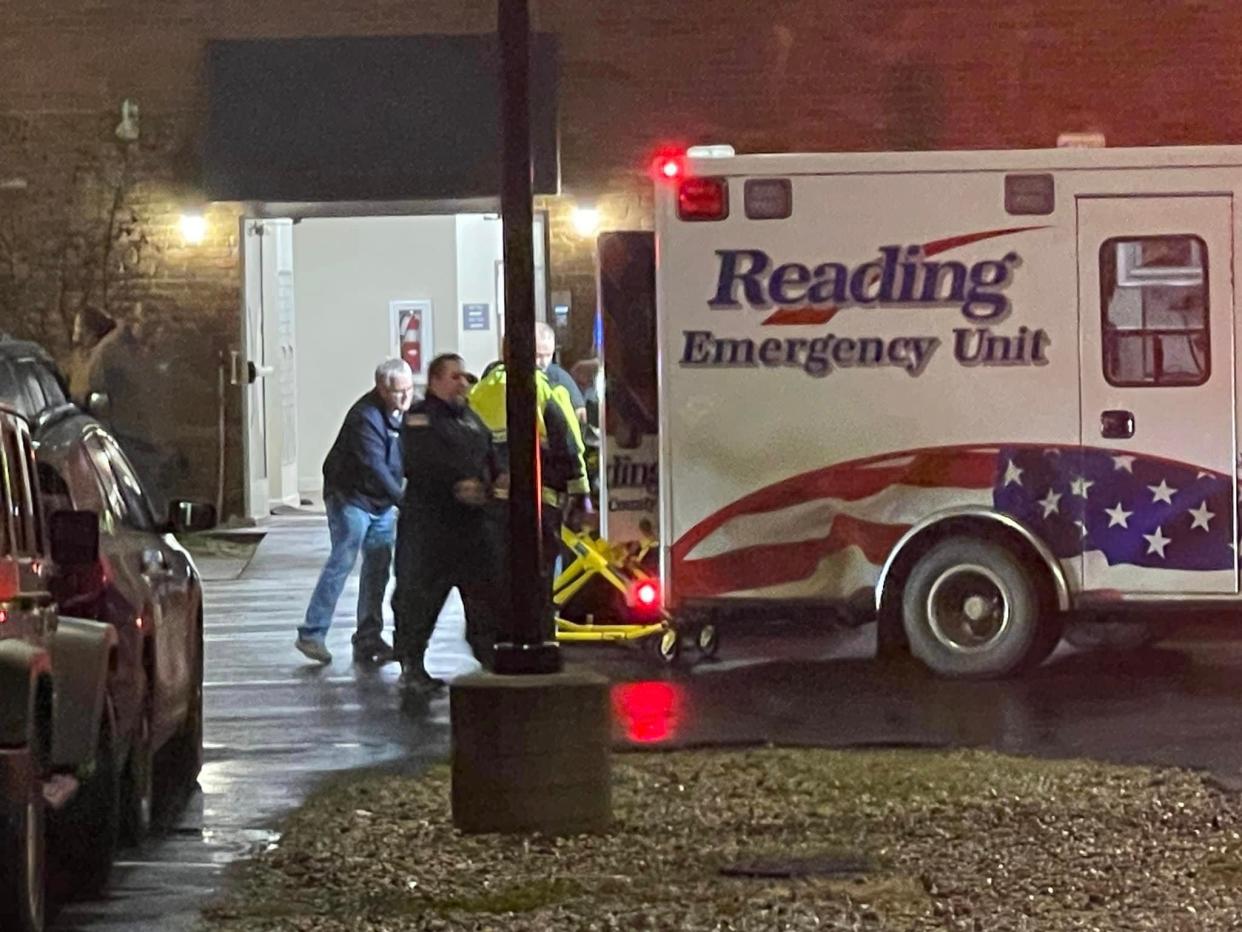 Emergency medical personnel load a stabbing victim into the back of a Reading Emergency Unit ambulance Saturday at Heritage Lane Apartments in Jonesville.