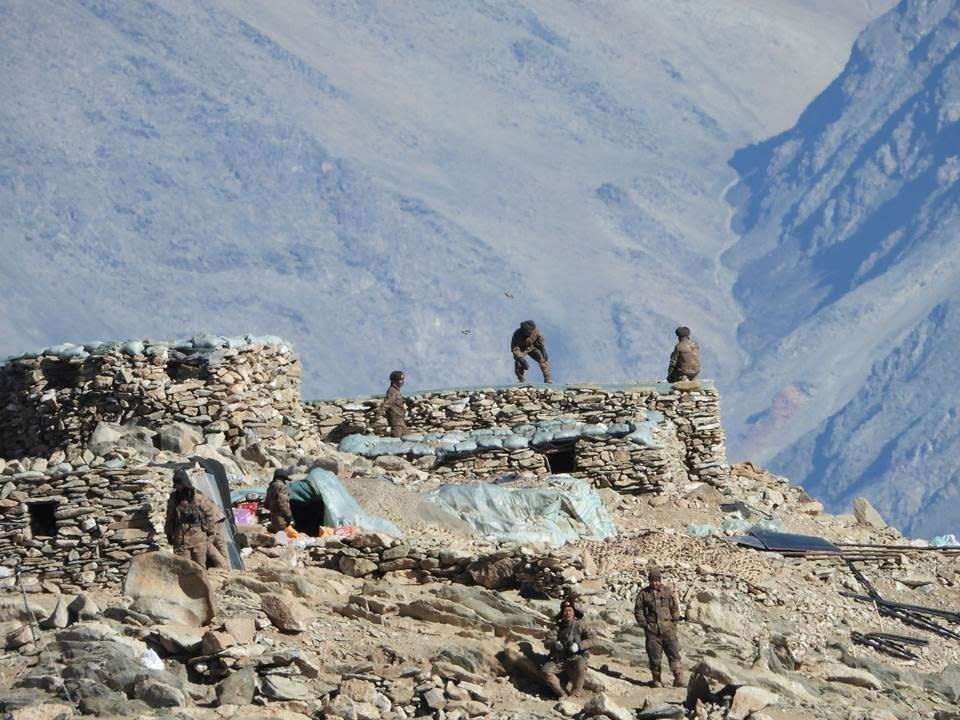 This photograph provided by the Indian Army, according to them shows Chinese troops dismantling their bunkers at Pangong Tso region, in Ladakh along the India-China border on Monday, Feb.15, 2021. China and India are pulling back front-line troops from disputed portions of their mountain border where they have been in a standoff for months. Both countries say the troops began the disengagement on Wednesday at the southern and northern banks of Pangong Lake in the Ladakh region. (Indian Army via AP)