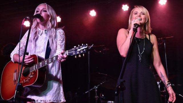 If <strong>Miranda Lambert</strong> is heartbroken, she's sure not showing it! The 30-year-old stepped out looking amazing at BFF <strong>Ashley Monroe</strong>'s album release party at The Basement in East Nashville on Wednesday, just days after news of her divorce from <strong>Blake Shelton</strong> went public. Wearing a figure-flattering black dress, a source exclusively tells ET, "Miranda looked amazing -- was smiling, happy, dancing, singing. She is having a great time and is here to support a very good friend." (She knew <em>every word </em>to Monroe's love song, "Has Anybody Ever Told You," co-written by Tyler Cain.) <strong> WATCH: Ashley Monroe Gets Hilarious With Dierks Bentley and Kip Moore at the ACMs </strong> The pals even embraced on-stage during a sweet rendition of Lambert's hit, co-written by Monroe, "Heart Like Mine." .@AshleyMonroe and @MirandaLambert onstage at the Basement East right now singing "Heart Like Mine." pic.twitter.com/1Oa2rJJqEa— Juli Thanki (@JuliThanki) July 23, 2015 YAY! @mirandalambert w/ @ashleymonroe now! LOVE her! pic.twitter.com/xnWOYvzBY3— FOCUSonthe615.com (@FOCUSonthe615) July 23, 2015 <strong> WATCH: Miranda Broke Down on Stage Just Before Announcing Divorce News </strong> Of course, Lambert and Monroe make up two-thirds of the country girl group The Pistol Annies. The trio, rounded out by Angaleena Presley, released their sophomore album <em>Annie Up</em> in 2013. At the Academy of Country Music Awards in April, Lambert teased that new music could be on the way. "We've been texting a lot and just trying to figure [everything] out," Lambert, who brought Monroe as her date to the ceremony, told ET on the red carpet. "When we get in a room, it's magic, and so we just have to find time in our schedules... to just get in a room for a couple of days and I'm sure more magic will happen." <strong> WATCH: Miranda Teases Pistol Annies’ Return! </strong> Lambert also revealed at the time that she was working on a follow-up to 2014's <em>Platinum</em>. But first, Monroe's new album <em>The Blade</em> will be released on Friday. See what else Lambert had to say about girl power in country music in the video below.