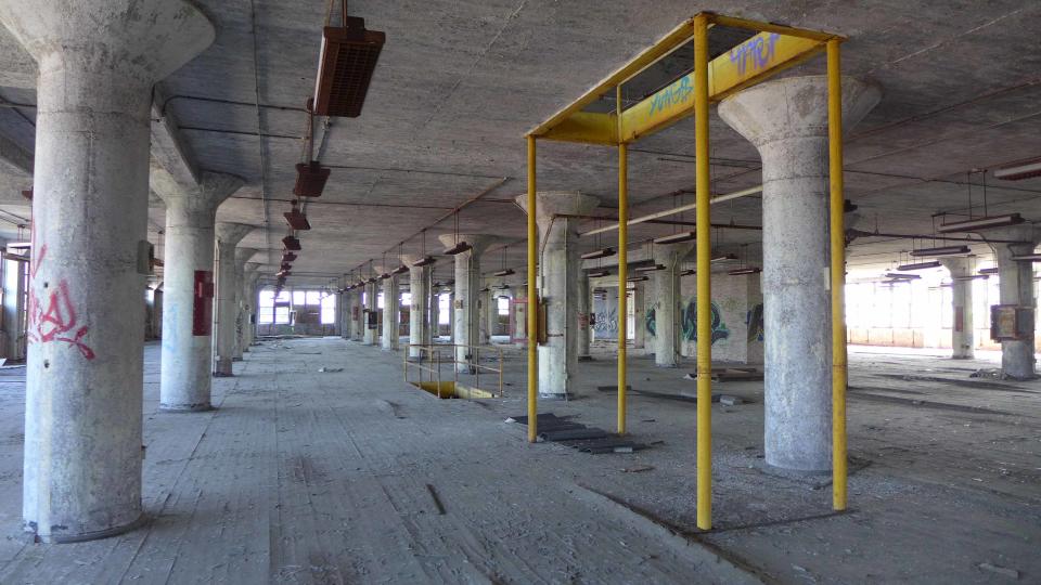 An interior look at the building at 1405 W. Broadway shows graffiti, a mark of its decades of vacancy. The former candy factory and tobacco warehouse is set to be turned into senior housing for those with low incomes.