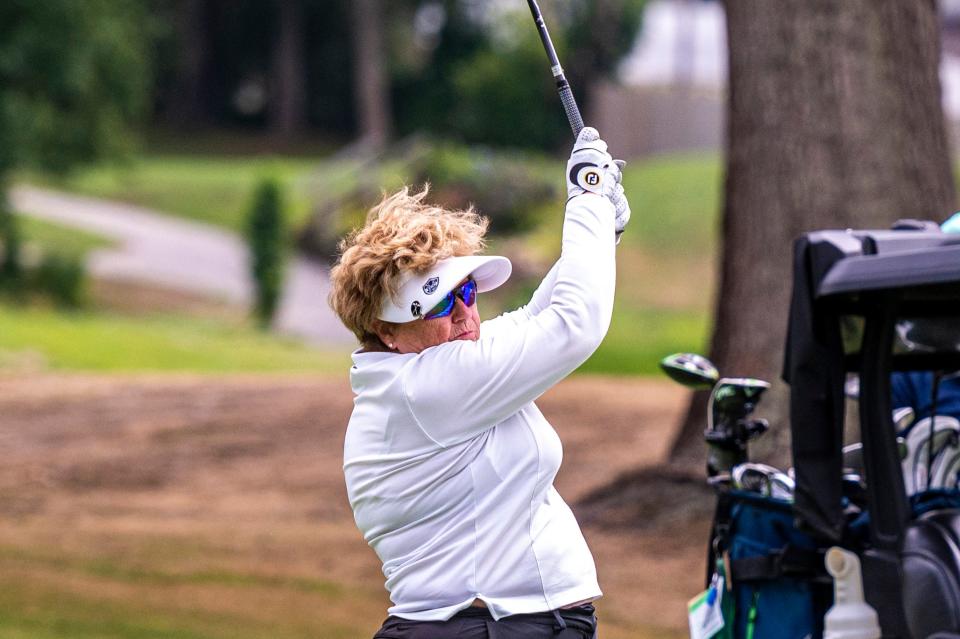 Diane LaCoste tracks her shot at the CCNB Women's Fourball Tournament.