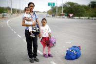 The Wider Image: Venezuelan mothers, children in tow, rush to migrate