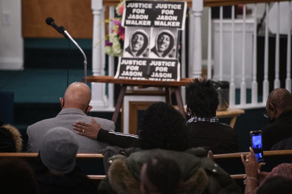 A family member comforts Jason Walker's father, Anthony Walker, during a rally at Good Hope Missionary Baptist Church on Thursday, Jan. 13, 2022. Jason Walker, 37, was shot and killed on Saturday by an off-duty deputy with the Cumberland County Sheriff's Office.