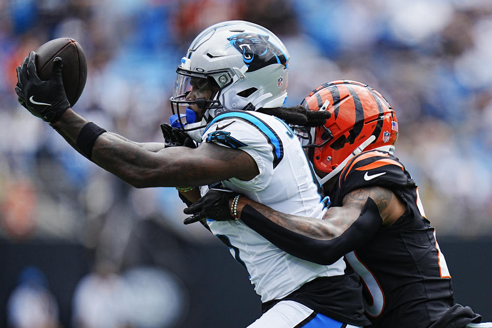 Carolina Panthers wide receiver Diontae Johnson catches a pass in front of Cincinnati Bengals cornerback DJ Turner II during the first half of an NFL football game, Sunday, Sept. 29, 2024, in Charlotte, N.C. (AP Photo/Rusty Jones)