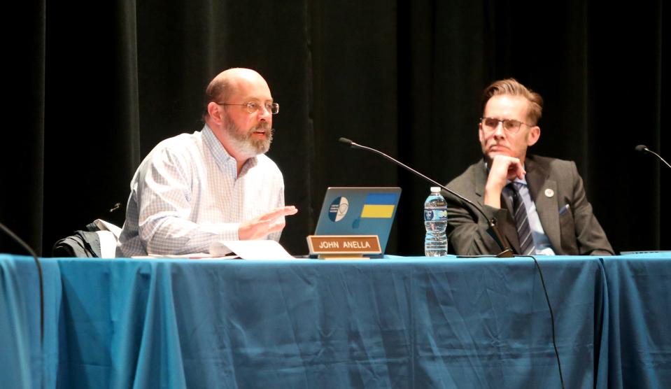 South Bend School Board President John Annella, left, and Supt. Todd Cummings  ask questions at the South Bend school board meeting Monday, March 20, 2023, at Clay High School.  Consultants recommended closure of Clay High School and Warren School in its facilities study findings to the board.