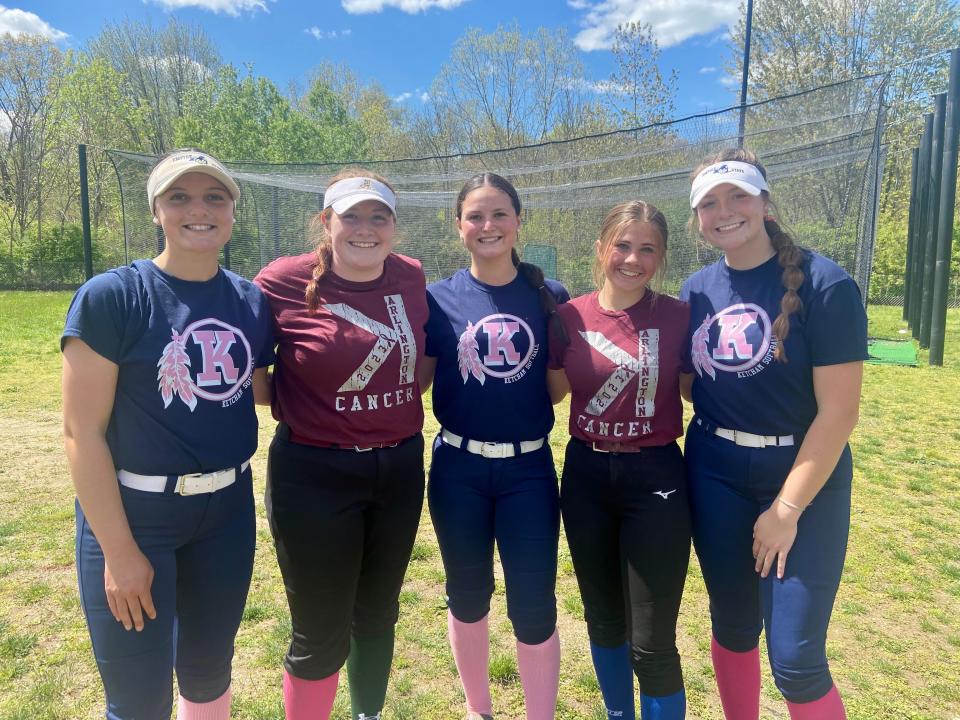 Members of the Roy C. Ketcham and Arlington softball teams pose together after Saturday's game, which was part of Arlington's Strike Out Cancer fundraiser. From left: Kat Hotle, Catherine Kelly, Paige Hotle, Sam Harris and Emma Kozlowski.