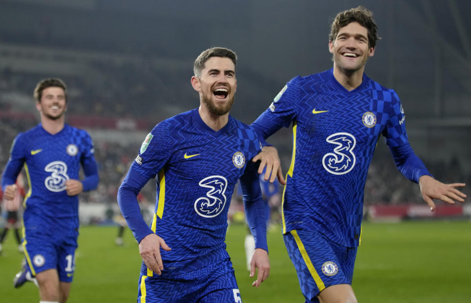 Chelsea's Jorginho, centre, celebrates after scoring his side's second goal during the English League Cup quarterfinal soccer match between Brentford and Chelsea at Brentford Community stadium in London, Wednesday, Dec. 22, 2021. (AP Photo/Kirsty Wigglesworth)