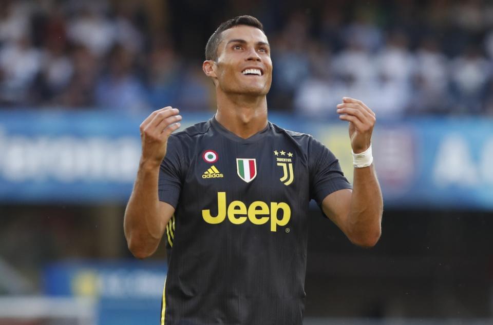 Juventus' Cristiano Ronaldo runs with the ball during the Serie A soccer match between Chievo Verona and Juventus, at the Bentegodi Stadium in Verona, Italy, Saturday, Aug. 18, 2018. (AP Photo/Antonio Calanni)