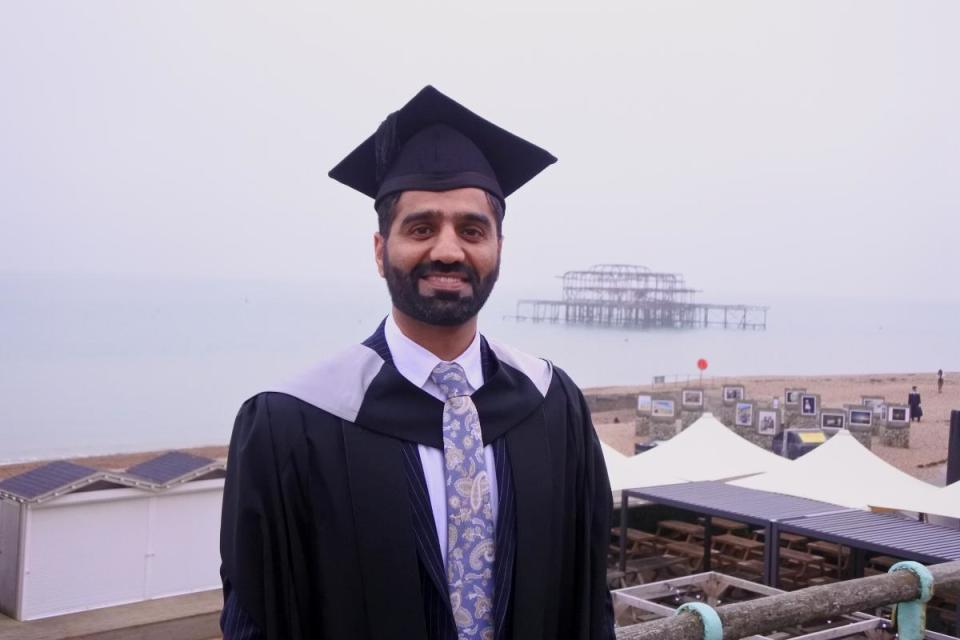 Naimat Zafary, who fled from Afghanistan with his family in 2021, graduated from Sussex University yesterday <i>(Image: The Argus)</i>