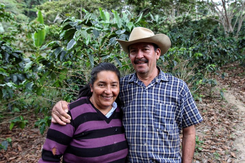 Arcadio Barajas and his wife Marta Moreno pose for a photo in the middle of a coffee plantation in San Lucas