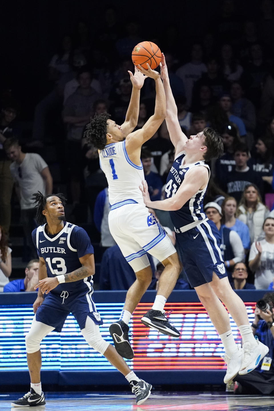 Xavier guard Desmond Claude (1) attempts to shoot as Butler guard Simas Lukosius (41) defends during the first half of an NCAA college basketball game, Saturday, March 4, 2023, in Cincinnati. (AP Photo/Joshua A. Bickel)