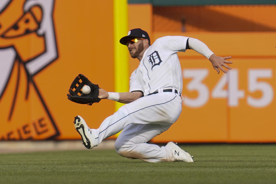 Detroit Tigers left fielder Robbie Grossman (8) catches a Minnesota Twins' Ben Rortvedt fly ball in the seventh inning of a baseball game in Detroit, Saturday, May 8, 2021. (AP Photo/Paul Sancya)