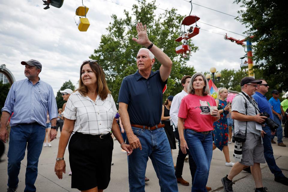 DES MOINES, IOWA - AUGUST 11: Former U.S. Vice President and current presidential candidate Mike Pence (C) and his wife Karen Pence (L) and Sen. Joni Ernst (R-IA) tour the Iowa State Fair on August 11, 2023 in Des Moines, Iowa. Republican and Democratic presidential hopefuls, including Florida Governor Ron DeSantis and former President Donald Trump, are expected to visit the fair, a tradition in one of the first states to hold caucuses in 2024. (Photo by Chip Somodevilla/Getty Images) ORG XMIT: 776016570 ORIG FILE ID: 1608469967