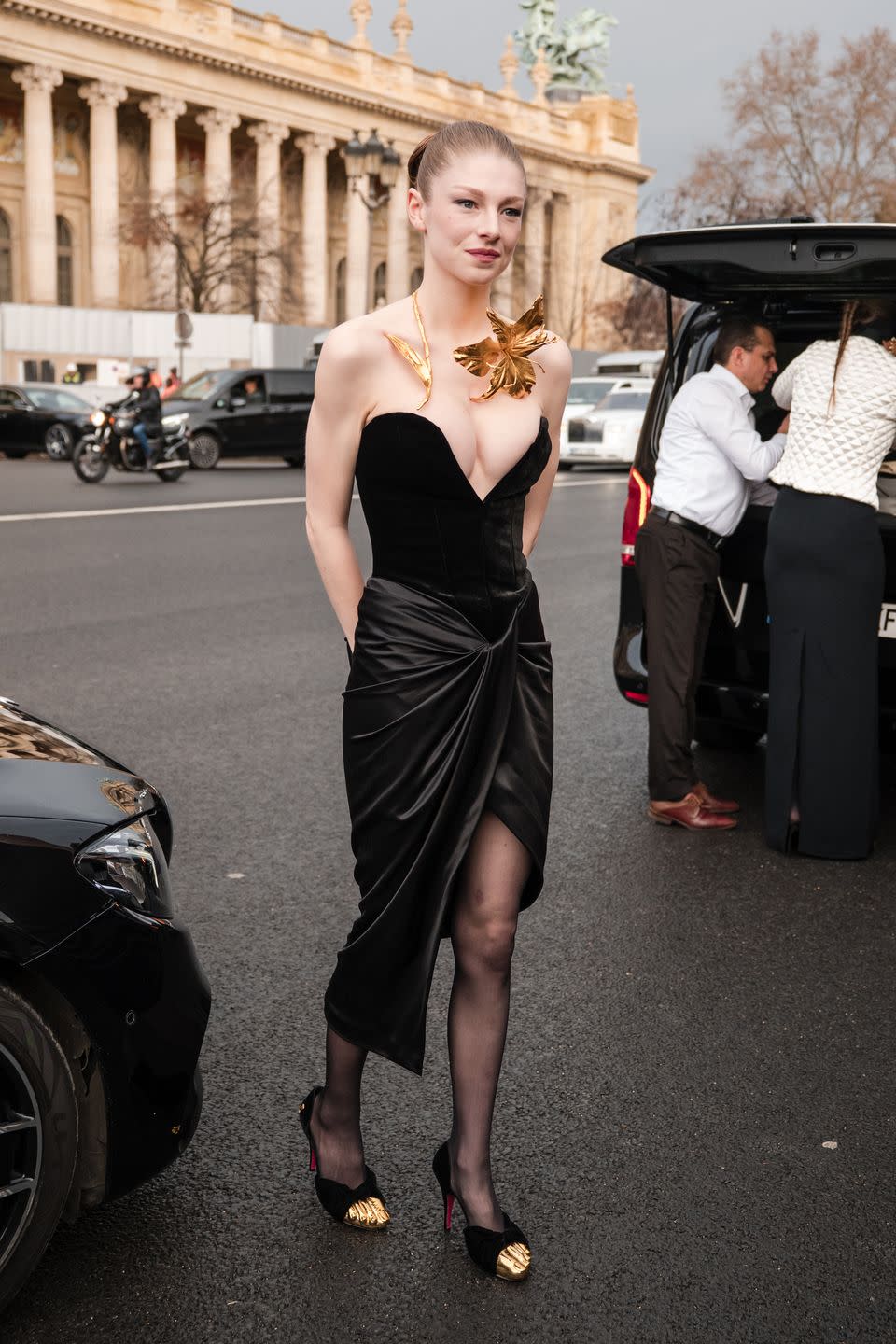 hunter schafer wearing a black dress during paris fashion week, january 2024