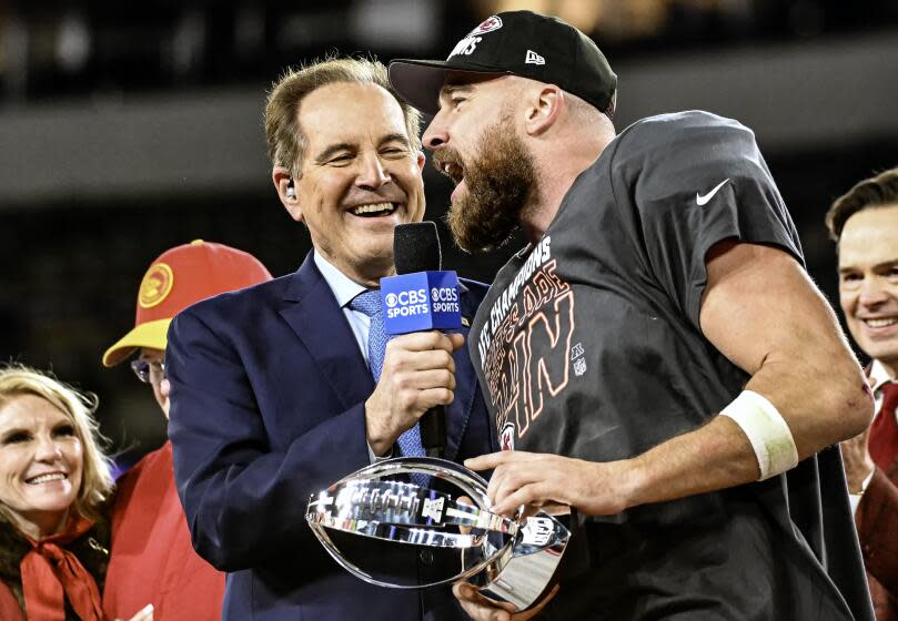 BALTIMORE, MD - JANUARY 28: Kansas City Chiefs tight end Travis Kelce (87) holds the Lamar Hunt trophy.