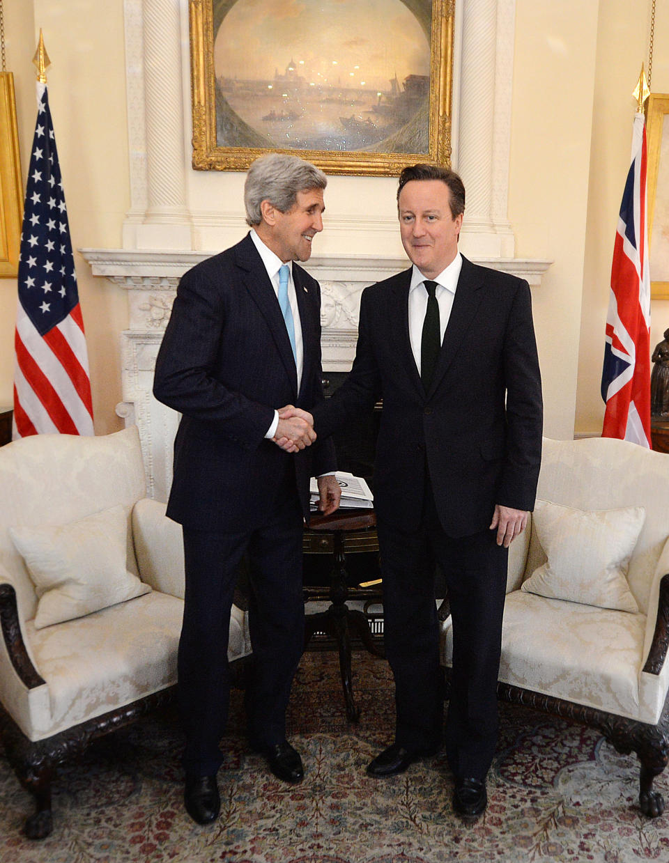 LONDON, UNITED KINGDOM - MARCH 14:  Prime Minister David Cameron (R) greets U.S. Secretary of State John Kerry at Downing Street, on March 14, 2014 in London, England. Mr Kerry will meet with his Russian counterpart Sergei Lavrov to discuss the Ukrainian crisis situation ahead of a disputed referendum in Crimea on Sunday. (Photo by Ben Stansall - WPA Pool/Getty Images)